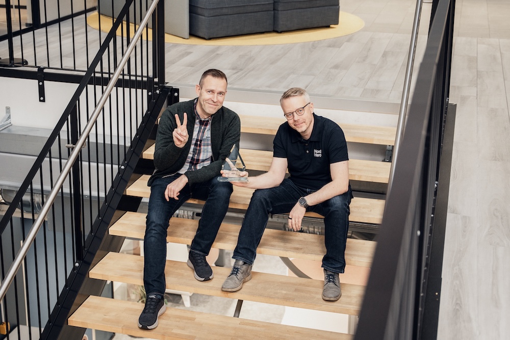 NordHero founders Pekka Malmirae and Janne Kuha, and the AWS 2025 Nordics Rising Star trophy